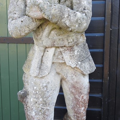 Lot 317 - An antique life size cast stone figure of a poacher