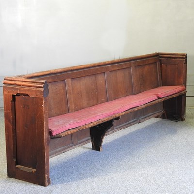 Lot 420 - A large 19th century stained pine church pew