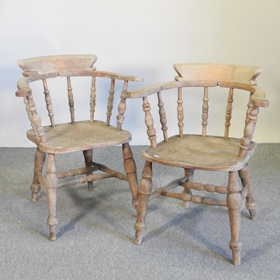 Lot 422 - A pair of elm seated captain's chairs