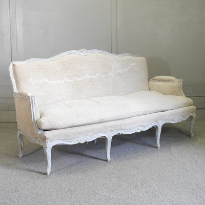 Lot 426 - A French carved and painted bergere sofa
