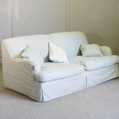 Lot 589 - A pale green upholstered sofa