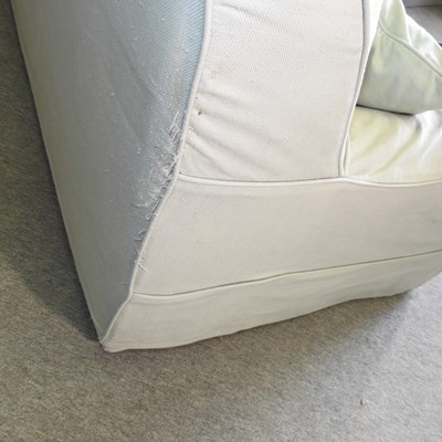 Lot 589 - A pale green upholstered sofa