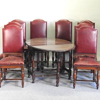 Lot 706 - A set of eight red leather upholstered high back dining chairs