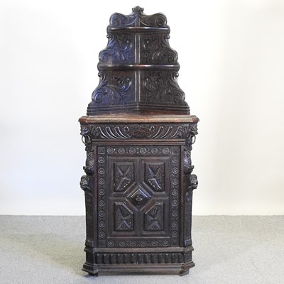 Lot 594 - A 19th century carved standing corner cabinet