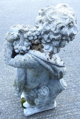 Lot 347 - A cast stone garden figure of a cherub