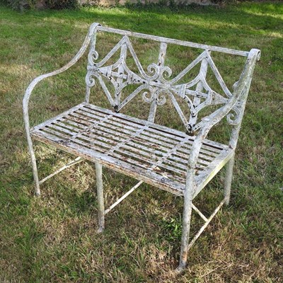 Lot 338 - A Regency style white painted cast iron garden bench