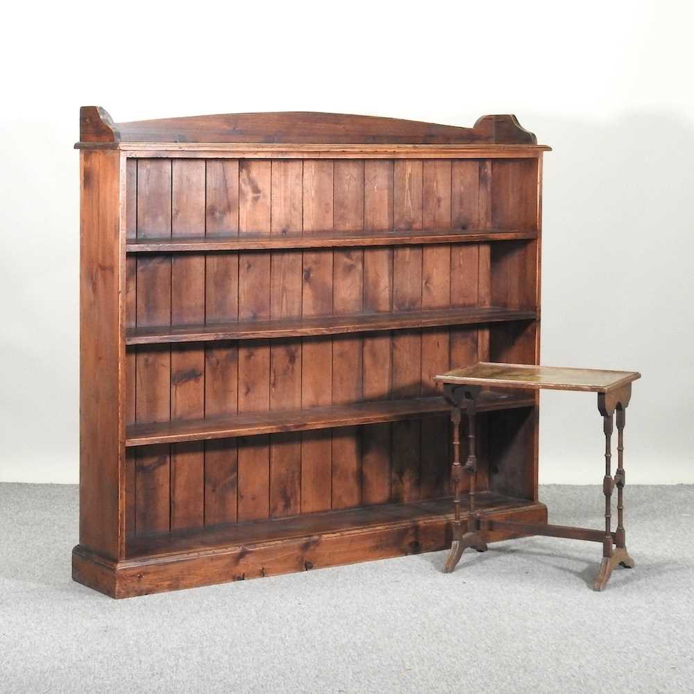Lot 465 - A stained pine open bookcase