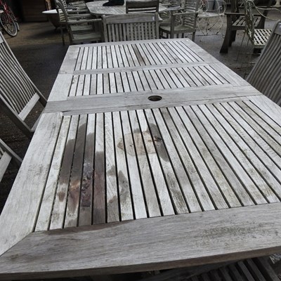 Lot 363 - A teak slatted extending garden table