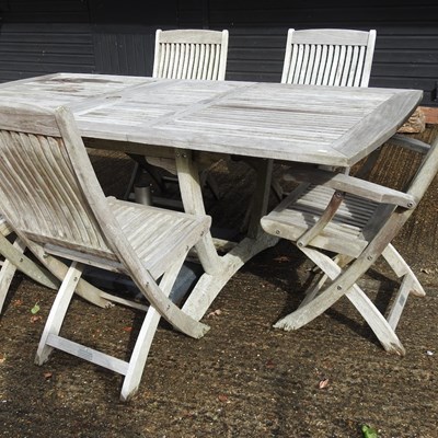 Lot 363 - A teak slatted extending garden table