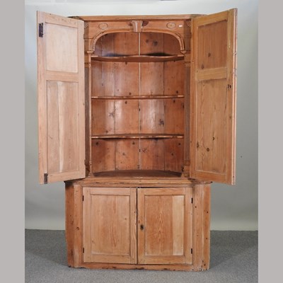 Lot 477 - A George III pine standing corner cabinet