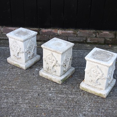 Lot 304 - A set of three cast stone garden pedestals
