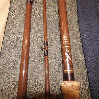 Lot 135 - A collection of vintage fishing rods
