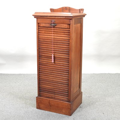 Lot 448 - An early 20th century oak tambour front filing cabinet