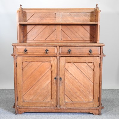 Lot 517 - A 19th century light oak chiffonier