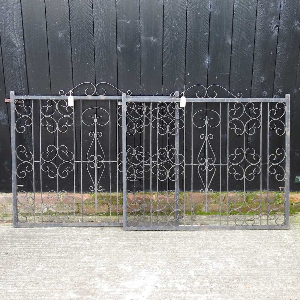 Lot 447 - A pair of black painted wrought iron garden gates