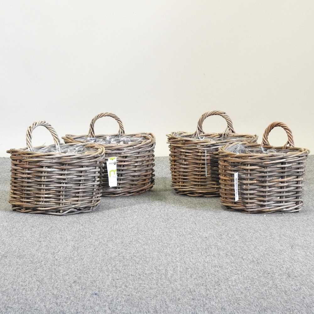 Lot 381 - A set of four wicker baskets