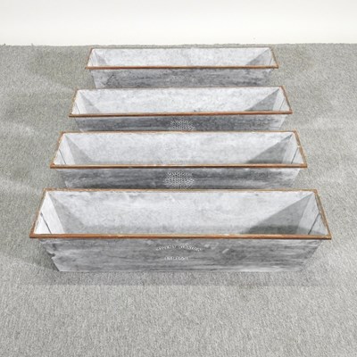 Lot 331 - A set of four metal planters