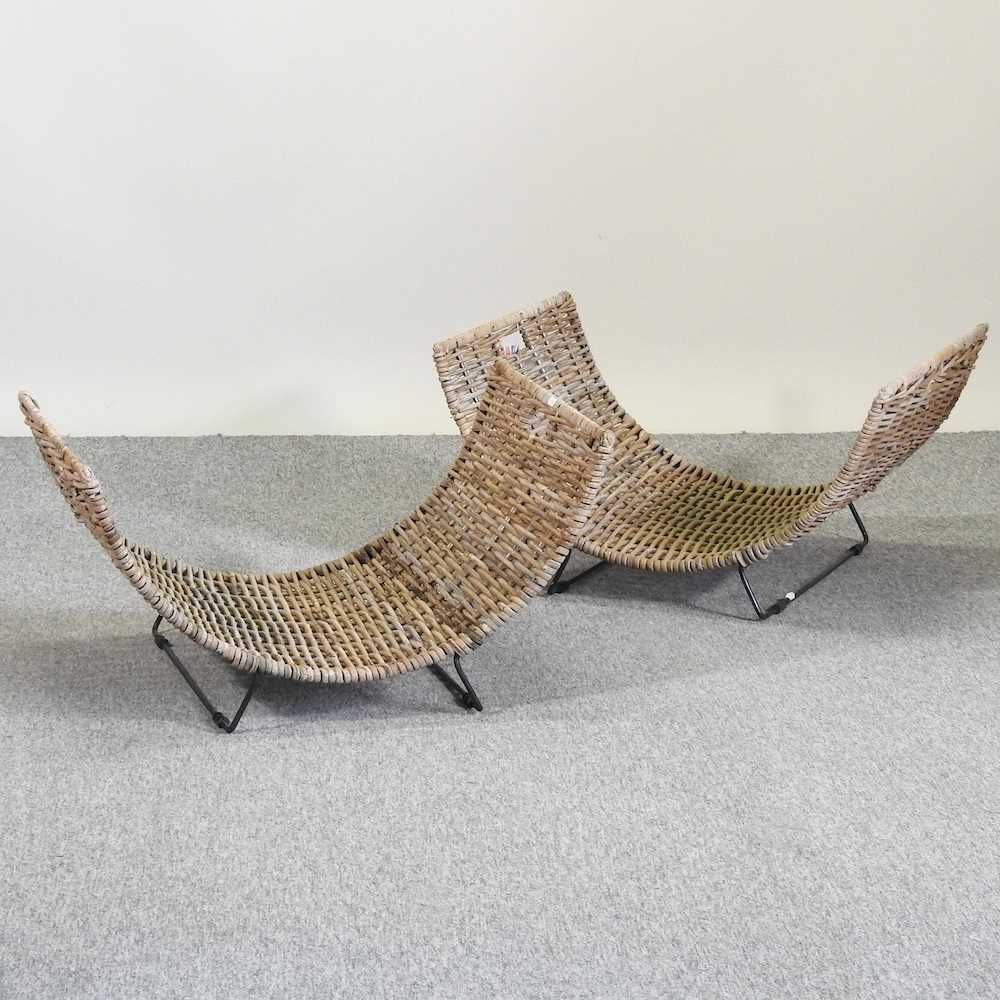 Lot 384 A pair of curved wicker log baskets