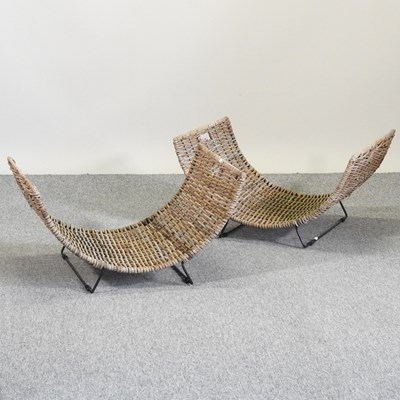 Lot 384 - A pair of curved wicker log baskets