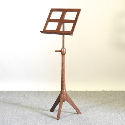 Lot 517 - A light oak music stand