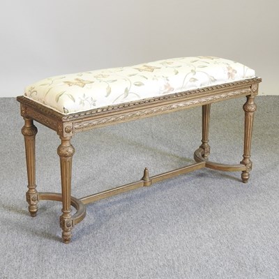 Lot 130 - A carved and gilt painted window seat