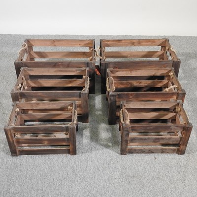 Lot 314 - Two sets of three brown apple crates