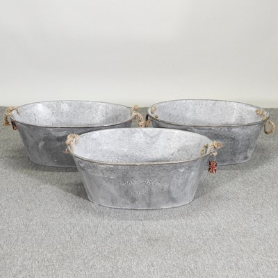 Lot 345 - A set of three metal planters