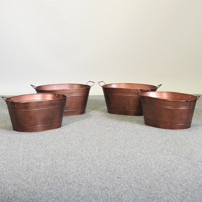 Lot 403 - A set of four painted metal planters