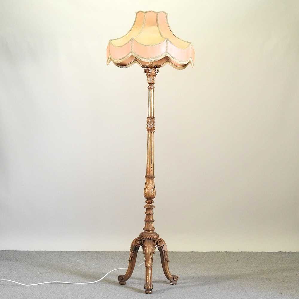Lot 82 - A carved and gilt painted standard lamp