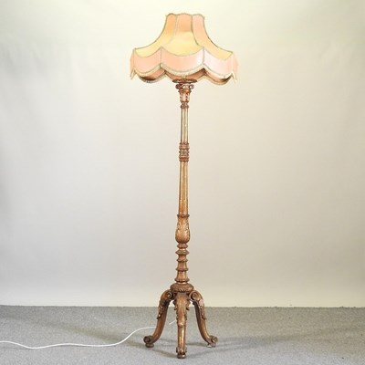 Lot 82 - A carved and gilt painted standard lamp