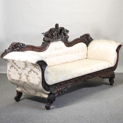 Lot 308 - A 19th century style carved and cream uphoklstered sofa