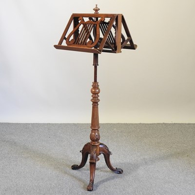 Lot 158 - An early 20th century walnut duet stand