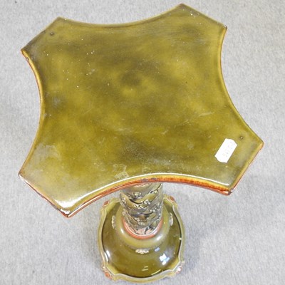 Lot 79 - An early 20th century green glazed jardiniere stand