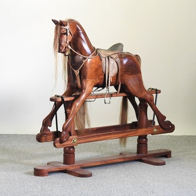 Lot 754 - A 20th century hardwood rocking horse