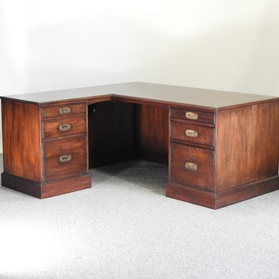 Lot 714 - A military style mahogany corner desk