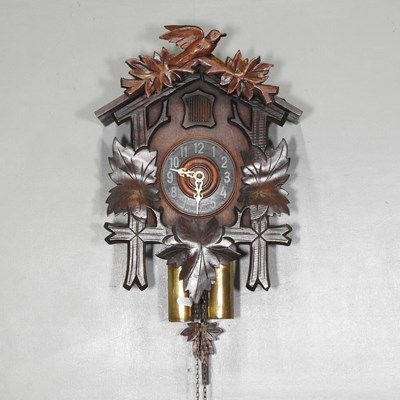 Lot 201 - An early 20th century carved wooden cuckoo clock