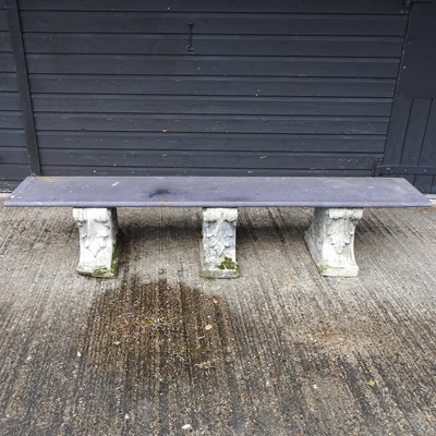 Lot 401 - A black slate garden bench