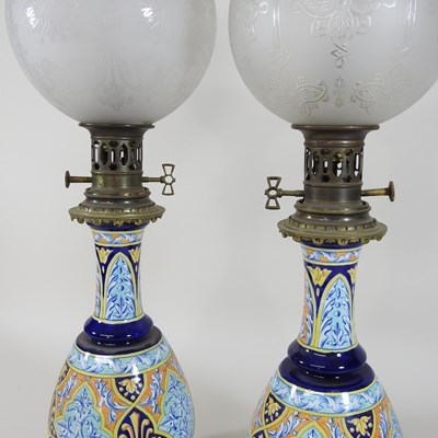 Lot 71 - A pair of late 19th century majolica oil lamps