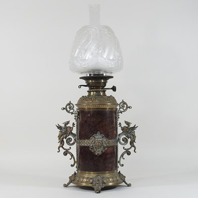 Lot 66 - A 19th century brass mounted hardstone oil lamp