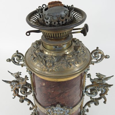 Lot 66 - A 19th century brass mounted hardstone oil lamp