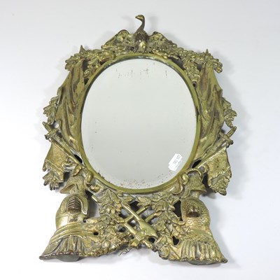 Lot 102 - An ornate gilt metal mirror