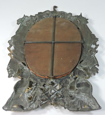 Lot 102 - An ornate gilt metal mirror