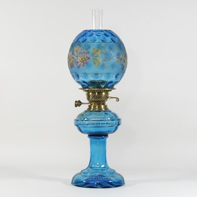 Lot 37 - A 19th century blue glass and painted oil lamp