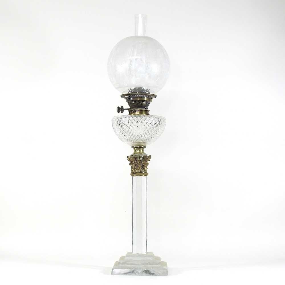 Lot 237 - A 19th century clear glass oil lamp