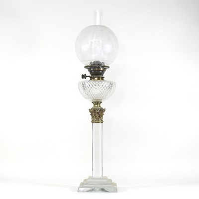 Lot 237 - A 19th century clear glass oil lamp