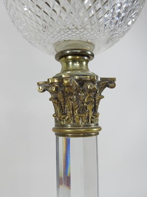 Lot 237 - A 19th century clear glass oil lamp