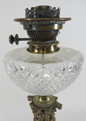 Lot 237 - A 19th century clear glass oil lamp