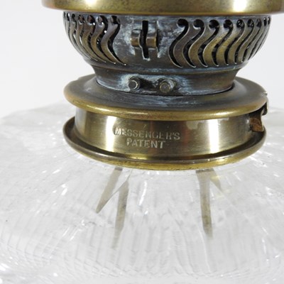 Lot 237 - A 19th century clear glass oil lamp