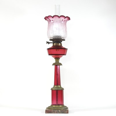 Lot 75 - A 19th century Irish ruby glass oil lamp