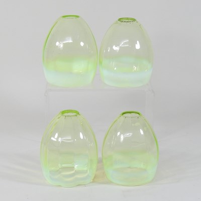 Lot 221 - A set of four early 20th century vaseline glass shades